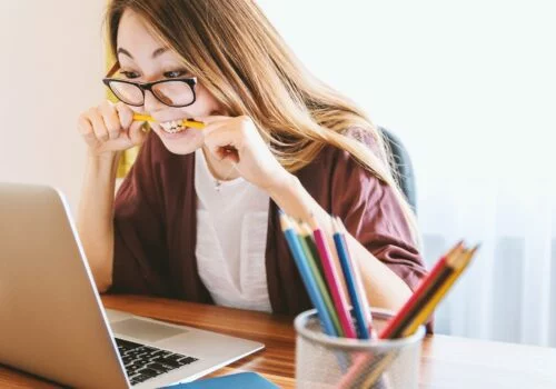 Woman Biting on his Pencil