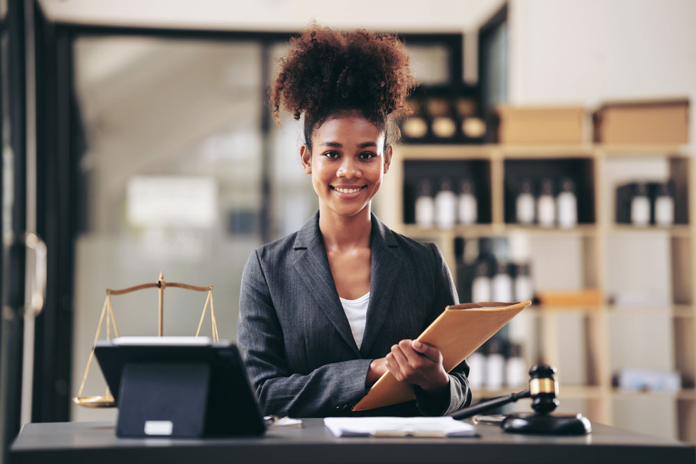 African american lawyer woman in suit holding envelope of business contract